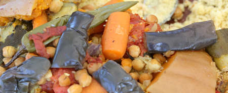 typical dish of cous cous with vegetables and carrots and chickpeasの写真素材