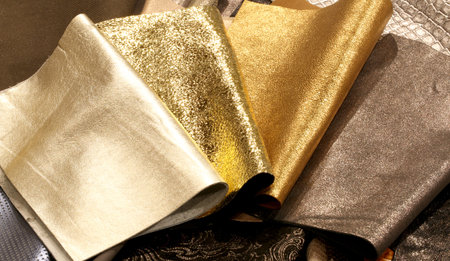 Precious fabrics with golden color of pieces of leather working
