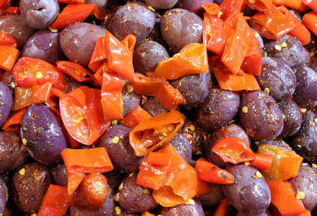 salad of black olives with red peppers and oregano typical dish of Mediterranean cuisineの写真素材
