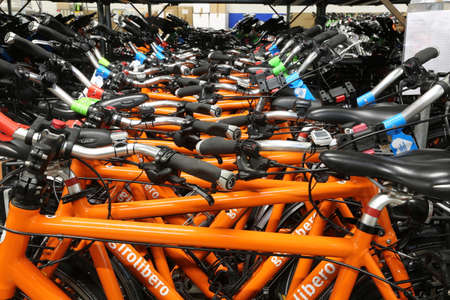 Vicenza, VI, Italy - January 1, 2017: Warehouse of orange bicycles for eco-sustainable tourism in the headquarters of famous tour operator called GiroLiberoのeditorial素材