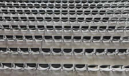 gray chairs without the spectators in the big sports facility before the sporting eventの写真素材