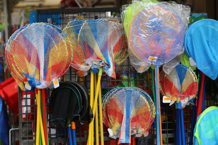 many fishing rod and fish net  in the toy store