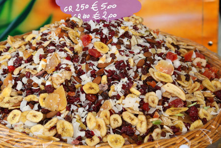 background of many dried fruits cherry banana cocco raisins almondsの写真素材