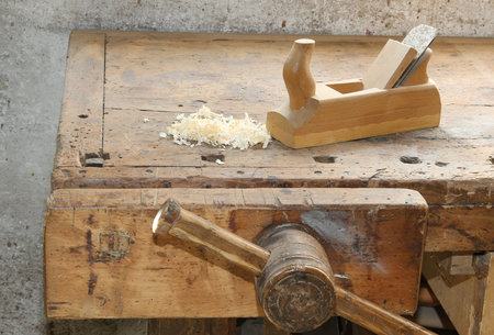 workbench of an artisan joinery with wooden vice and the planer