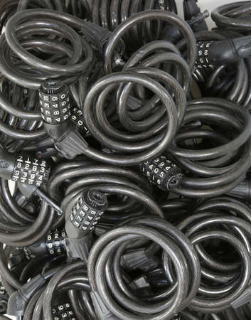 many black heavy  padlocks with the combination to avoid bothering to steal the bicycle by thievesの写真素材