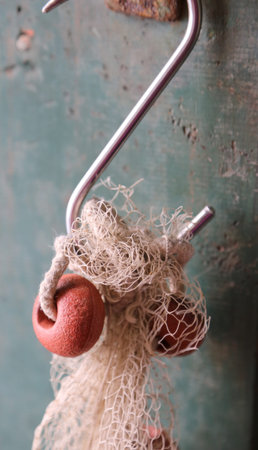 detail of a fishing boat with big hook and float with fishing net