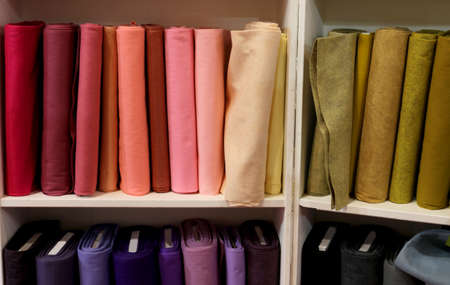 shelf of haberdashery with lots of fabrics for saleの写真素材