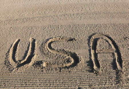 big text WORD USA United States of America on the sand of the beachの写真素材
