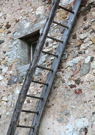 long wooden ladder near the old house in the farmの写真素材