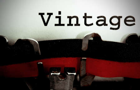 Big VINTAGE written with the old typewriter on white pageの写真素材