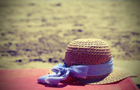 straw hat on the beac with vintage style effecth in summerの写真素材