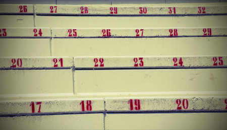 numbers on the stairs in the stadium to indicate the seat  with vintage style effect