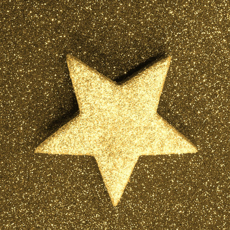 lone great golden star on golden background