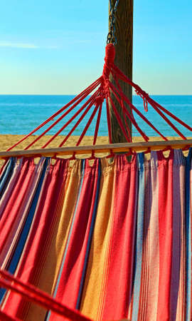 hammock for relaxing on the beach by the sea at the luxury resort iの写真素材