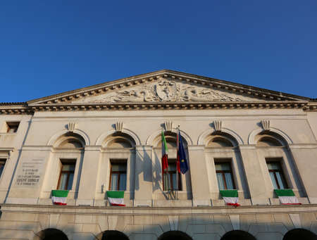 Chioggia, VE, Italy February 11, 2018: ancient palace of Town hall with many italian flagsのeditorial素材