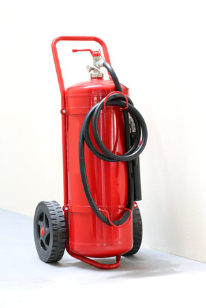 Big wheeled fire extinguisher with black pipe