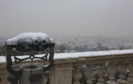telescope to see vicenza city in northern italy during a snowfall in winterのeditorial素材