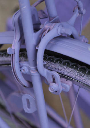 brakes of the purple bike with padlock antitheftの写真素材