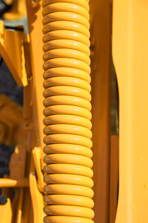 large yellow spring of an industrial heavy transport vehicleの写真素材
