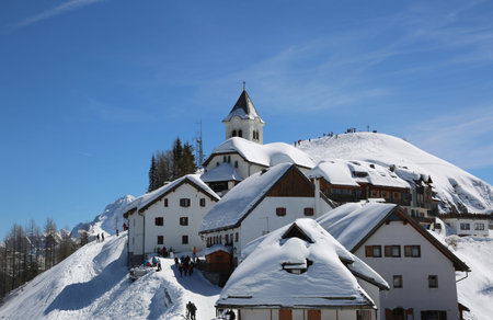 Lussari Mountain, UD, Italy - April 1, 2018: Old Sanctuary and more buildings with snow in springのeditorial素材