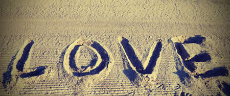 text LOVE in the sand of the beachの写真素材
