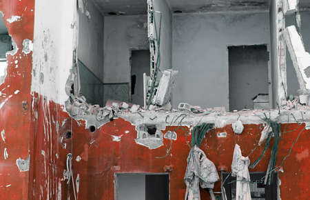 Red and white old damage house after the disasterの写真素材