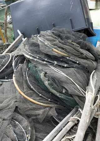 many nets of fishermen on the boat just back to shore after night offshore