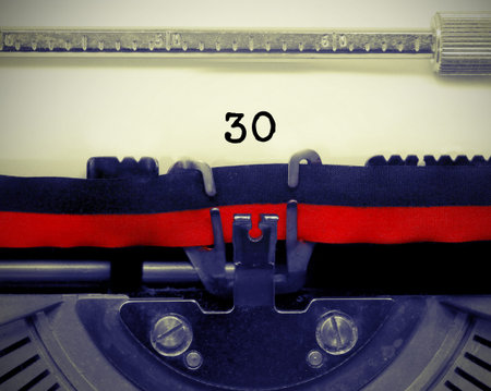 30 Number text written by an old typewriter on white sheet