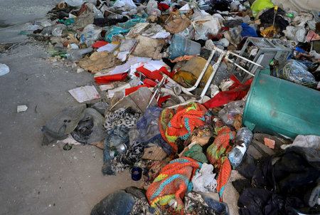 homeless shelter with many blankets tatters and verty idrty material