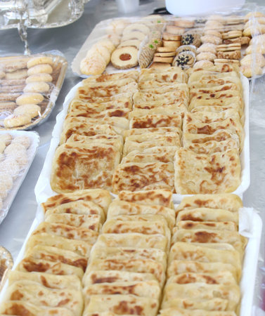 typical treats of North Africa on white trays at a party