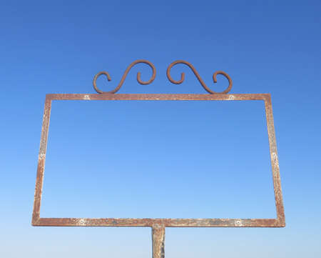 metallic frame with the blue sky background to be able to write something insideの写真素材