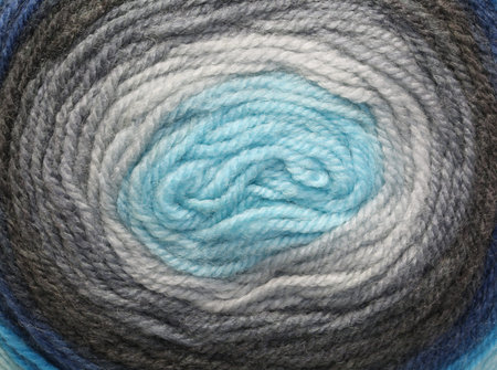 long spiral of twine of various colors of wool