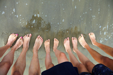 ten feet of a family of five person on the beach