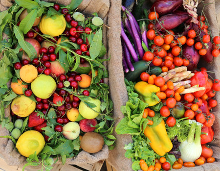 two boxes of fruits and vegetables for sale at supermarket