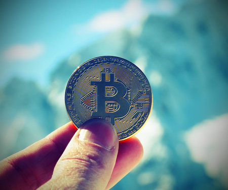 bitcoin money on the hand of a manの写真素材