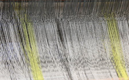 old frame for weaving yarns with colored threads