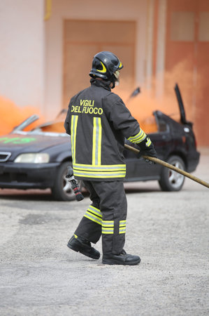 Italia, Italy - May 10, 2018: brave italian fireman during the practice drill at fire station with...