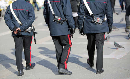 Venice, VE, Italy - February 5, 2018: three italian cops called Carabinieri in the St. Mark Square during the Carnival Festivalのeditorial素材