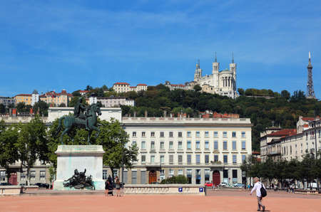 Lyon France the main Square called Place Bellecour and the Basilica over the hill and Equestrian statue of Louis XIVの写真素材