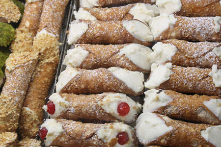 typical Sicilian cannoli stuffed with ricotta and candied fruitの写真素材