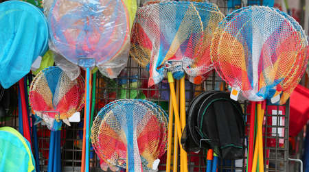 many fishing rod and fish net  in the storeの写真素材