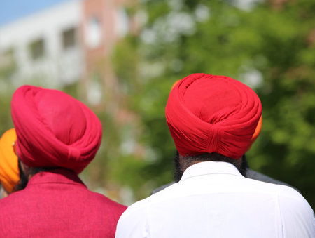 religious Sikh procession with two men with big turbans