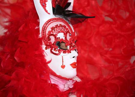 Venice, VE, Italy - February 5, 2018: masked woman in RED at the Venice Carnival in Saint Mark Squareのeditorial素材