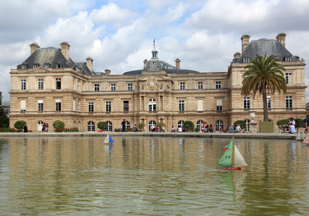 Paris, France - August 21, 2018: Luxembourg Palace and little lake with boatsのeditorial素材