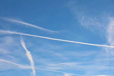 many white many contrails left by airliners or are chemtrails according to the conspiracy theory