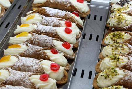 many typical pastries for sale in Sicily in Italy called SICILIAN CANNOLI in Italian language