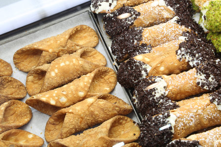 empty pastries or with cheese and chocolate in the pastry called CANNOLI SICILIANI in Italian...