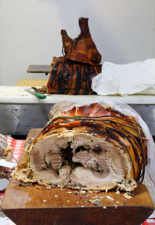roast pork ideal for tasty sandwiches and the large roast pork head for sale in the butcher's shopの写真素材