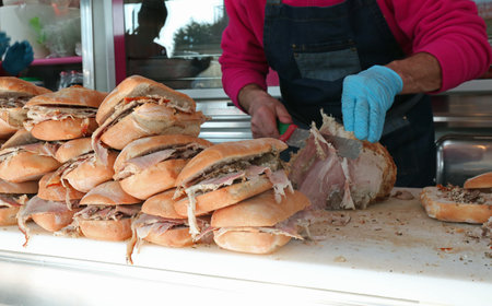 sandwiches with roasted pork for sale at kiosk of street food