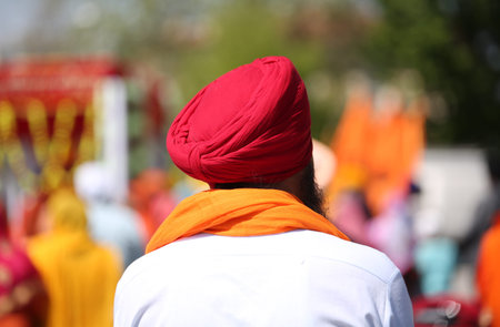indian man with red turban and white shirt